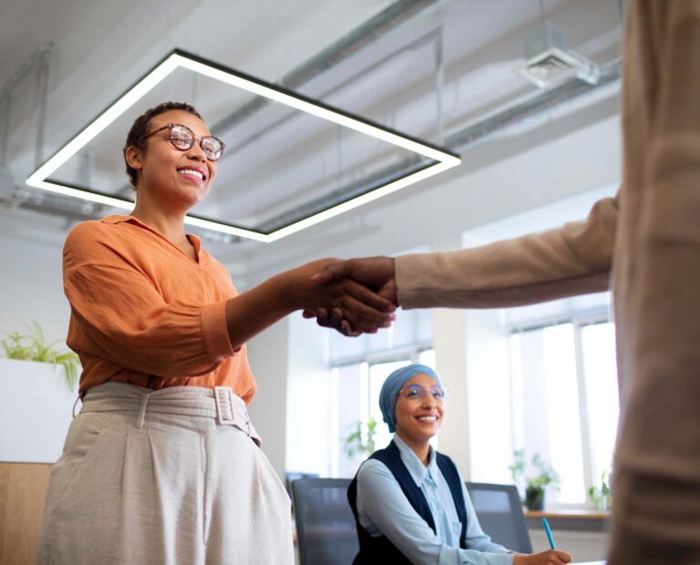 man introducing himself employers office job interview 1 768x620